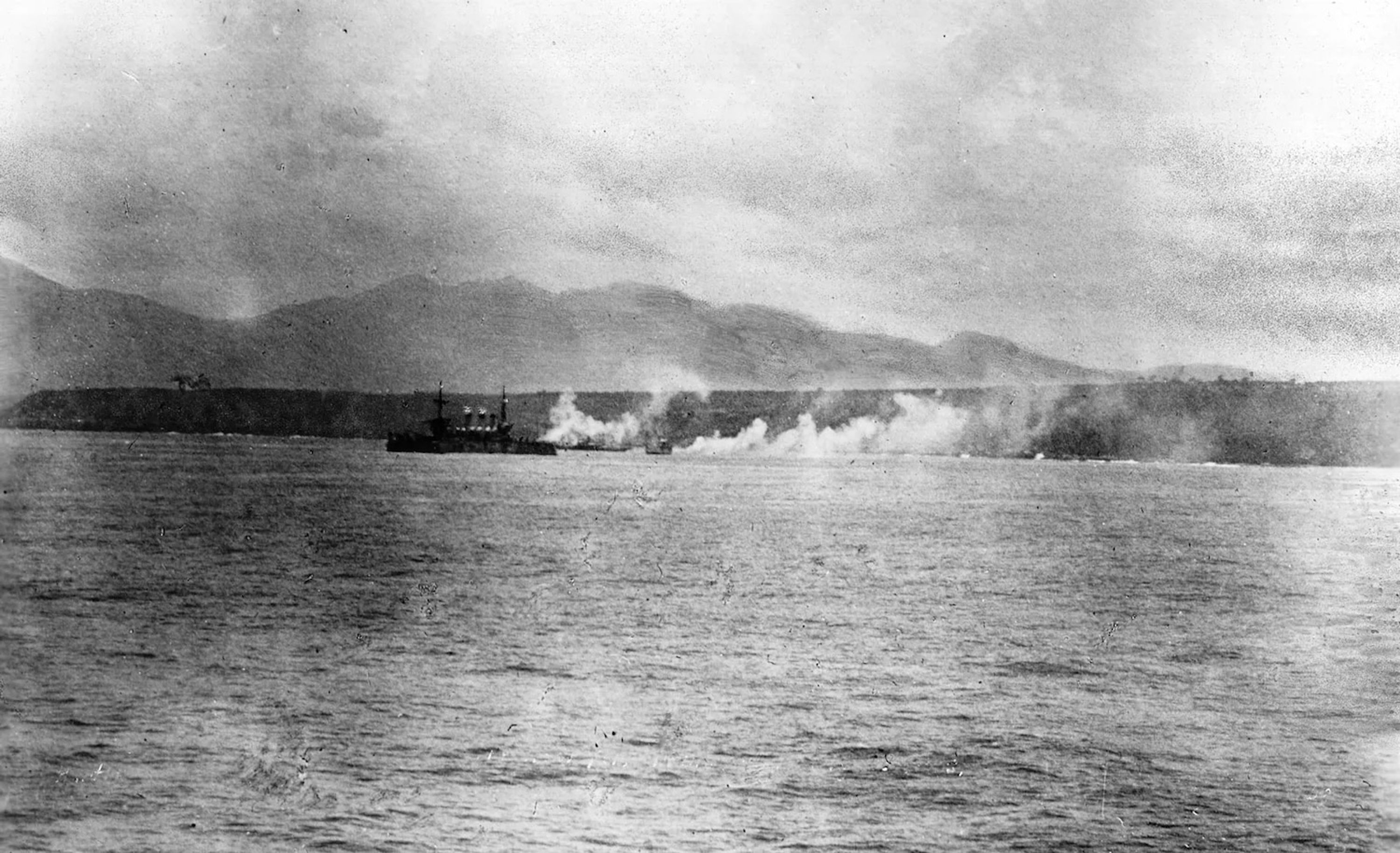 The American cruiser New York bombards Spanish positions in Cuba